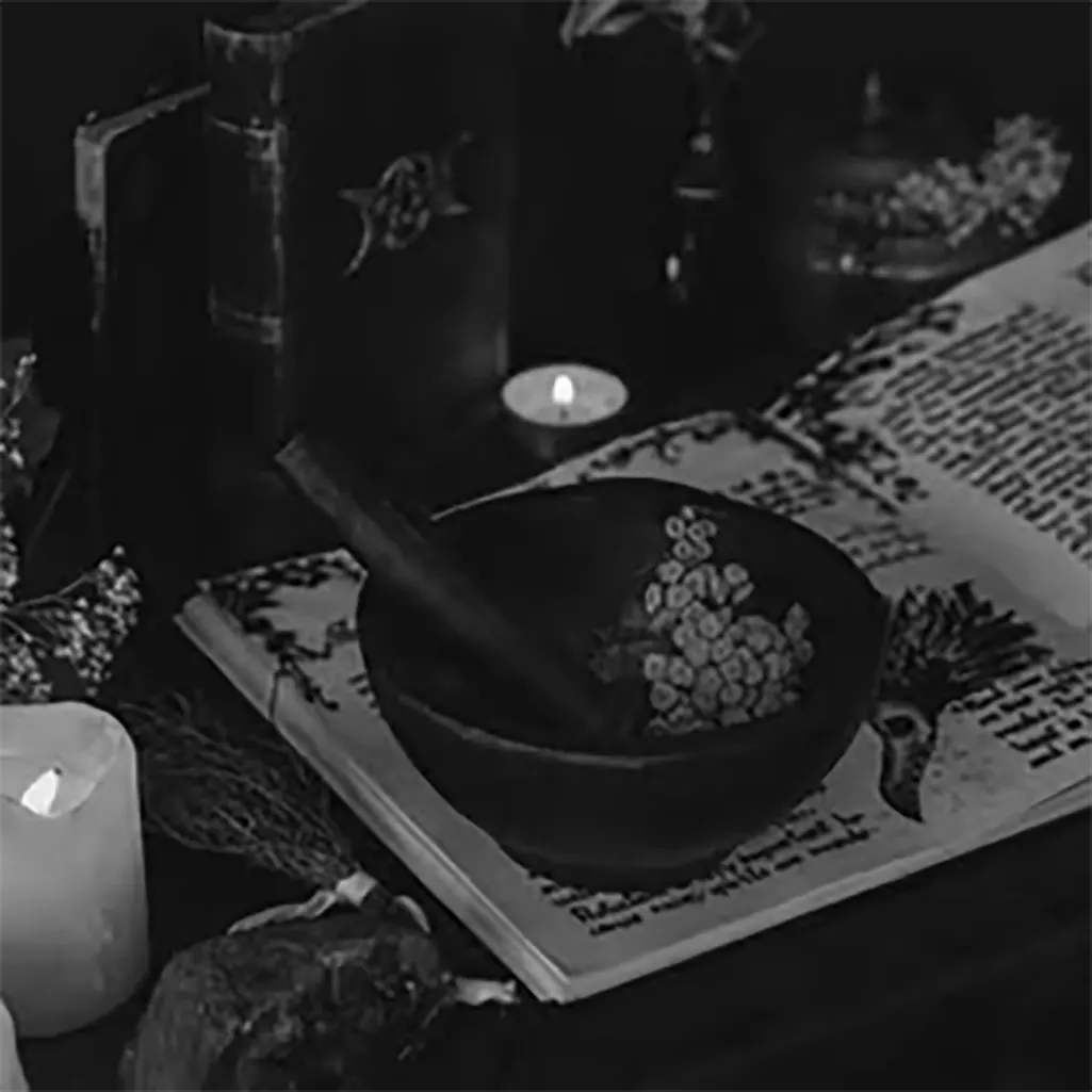 A pestle and mortar on a witches spellbook