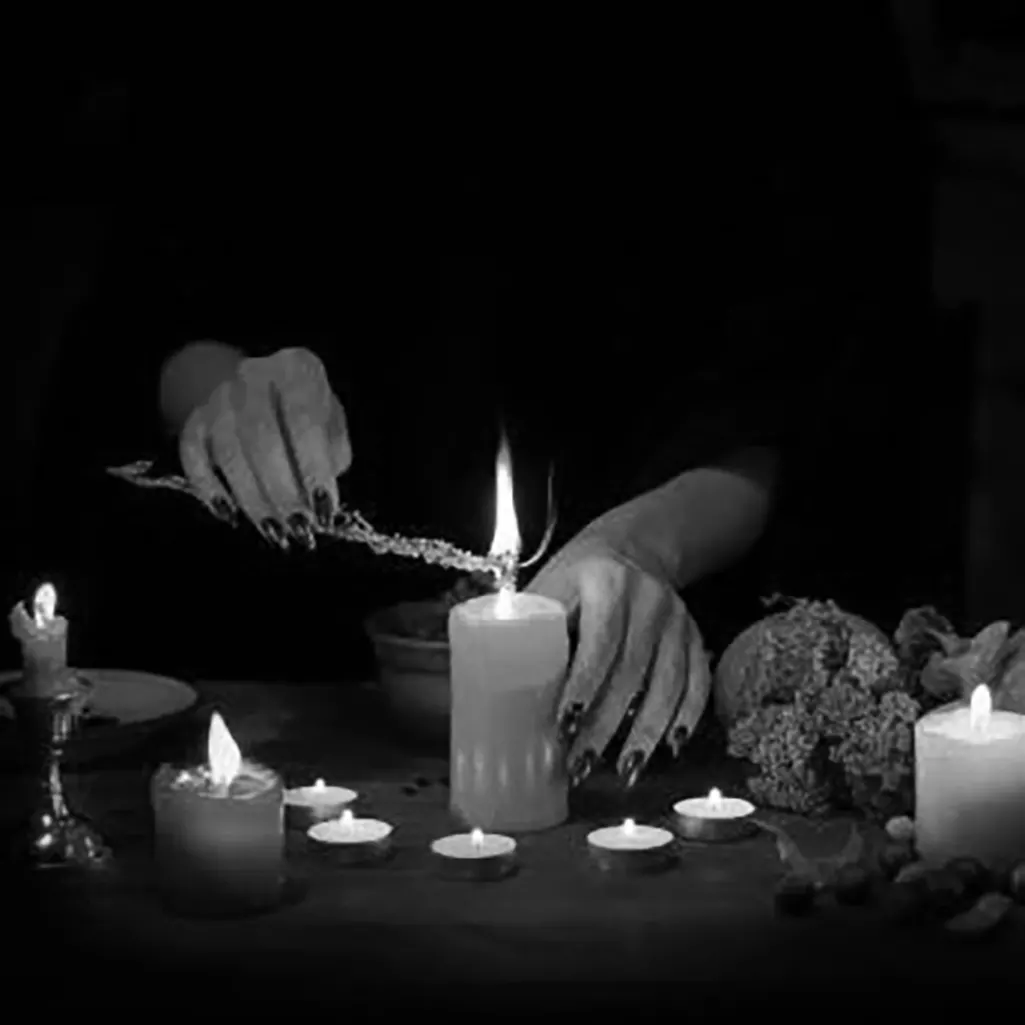 A witch lighting candles