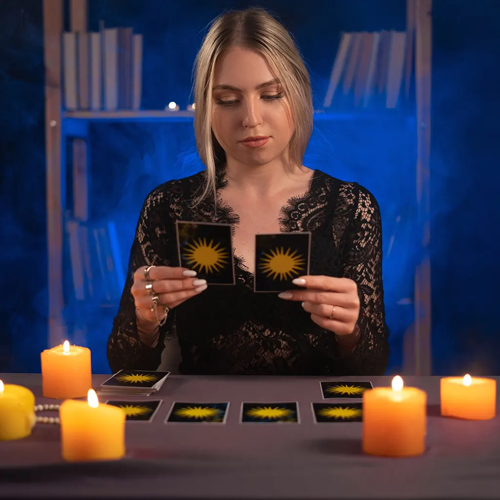 A photo of a woman reading two tarot cards